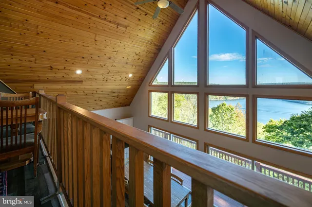 a view of a table and chairs on the roof deck