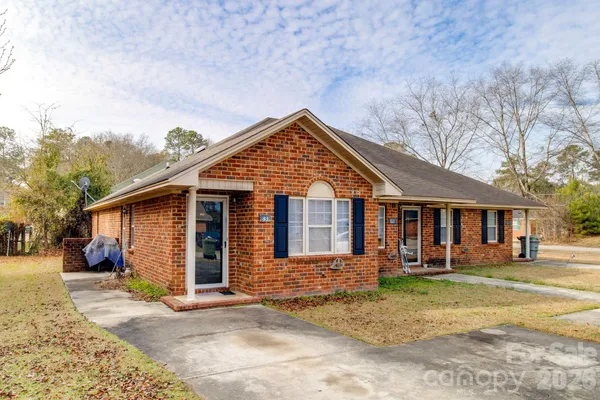 a front view of a house with a yard