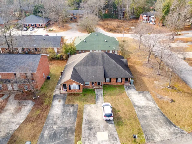 an aerial view of a house with swimming pool
