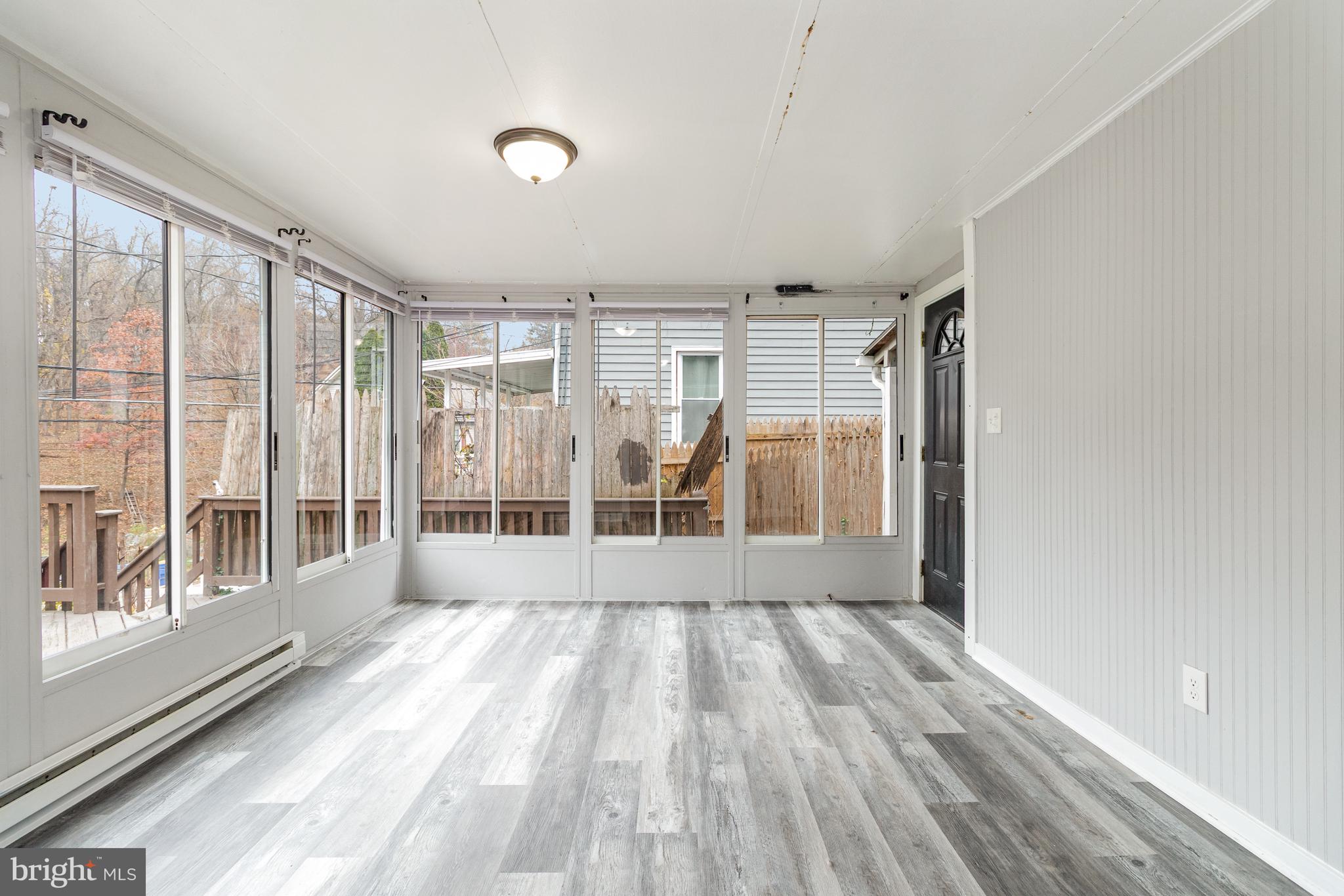650 Mohn Street Harrisburg, PA 17113 - Photo 2 of 29 a view of wooden floor and windows in a room