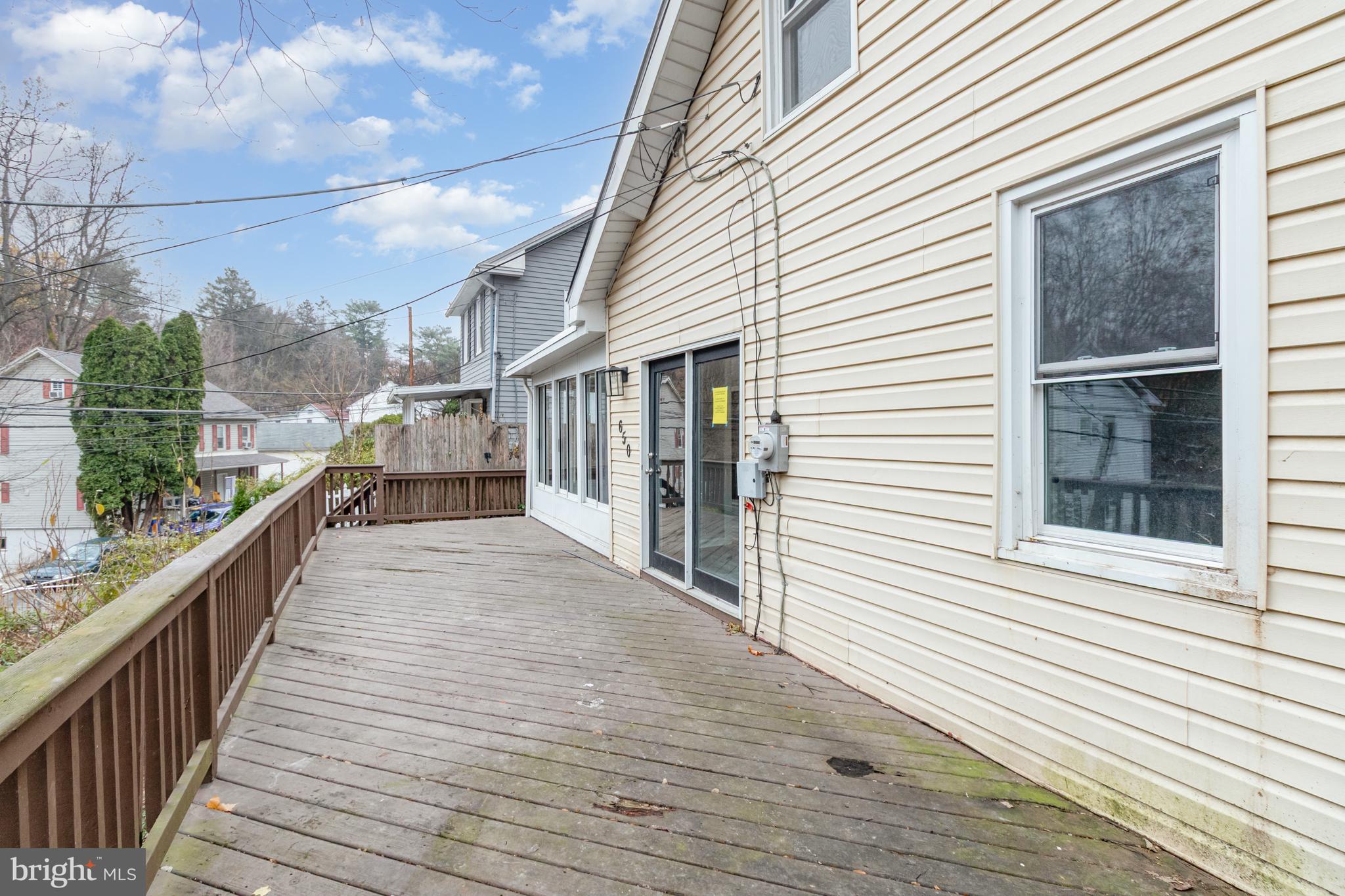650 Mohn Street Harrisburg, PA 17113 - Photo 22 of 29 a view of a balcony with wooden floor and fence