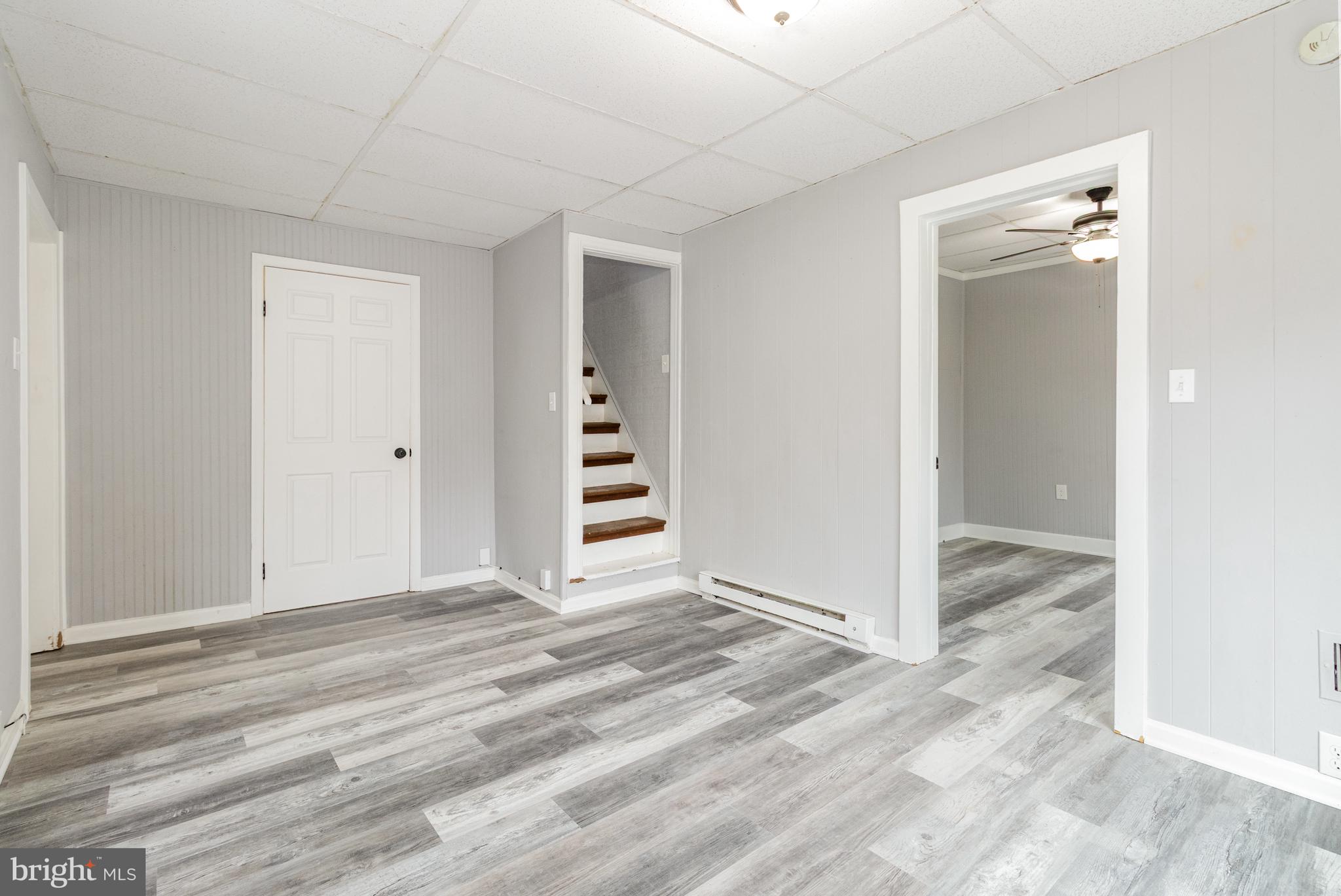 650 Mohn Street Harrisburg, PA 17113 - Photo 7 of 29 a view of empty room with wooden floor and cabinet