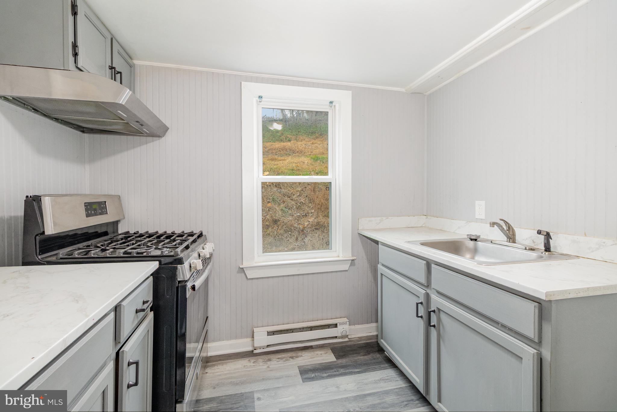 650 Mohn Street Harrisburg, PA 17113 - Photo 9 of 29 a kitchen with stainless steel appliances granite countertop a sink a stove and a refrigerator