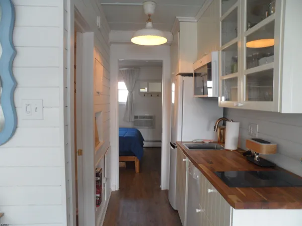 a kitchen with stainless steel appliances granite countertop a sink and a stove