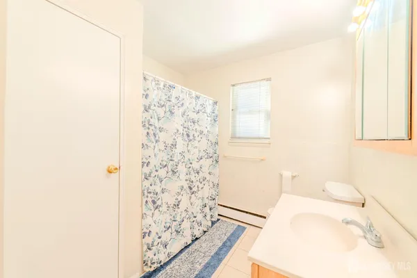 a bathroom with a bathtub and shower