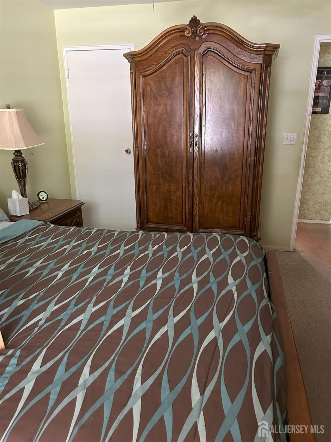 6 York Drive, Unit 5A Edison, NJ 08817 - Photo 10 of 18 a view of a bedroom with a wooden door