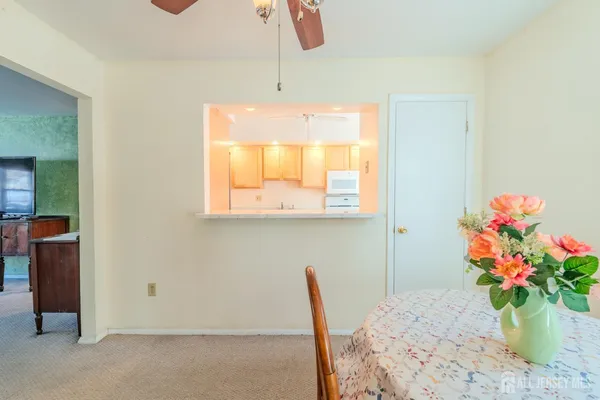 a bathroom with a tub sink and a window