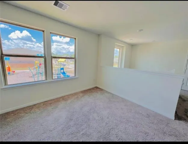 an empty room with windows