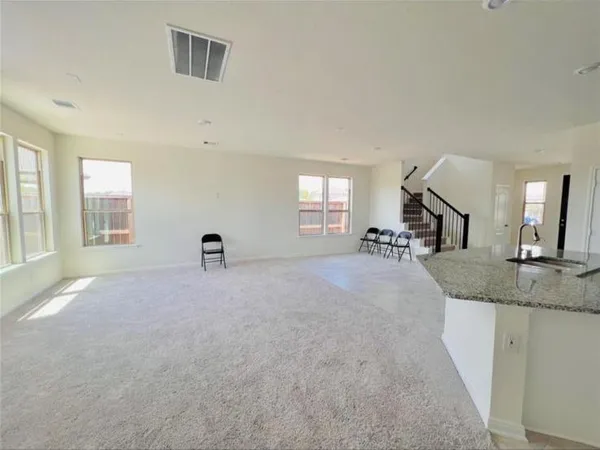 a view of a livingroom with a furniture and a window