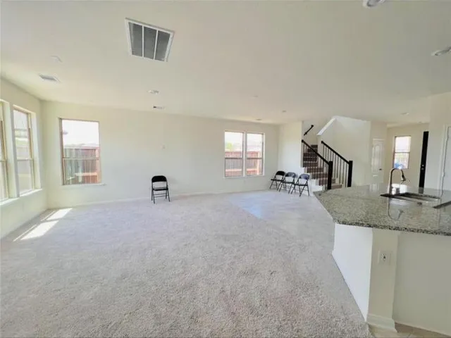 a view of a livingroom with a furniture and a window