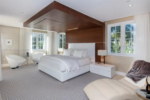 a bedroom with bed and wooden floor