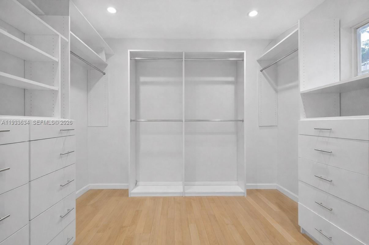 11890 Southwest 72nd Place Pinecrest, FL 33156 - Photo 19 of 39 a view of a walk in closet