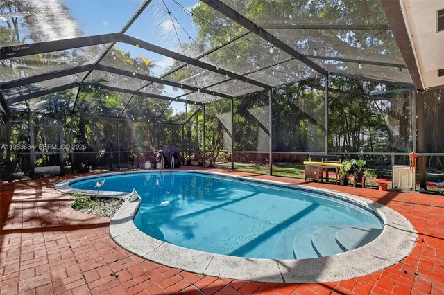 a view of a swimming pool with a patio