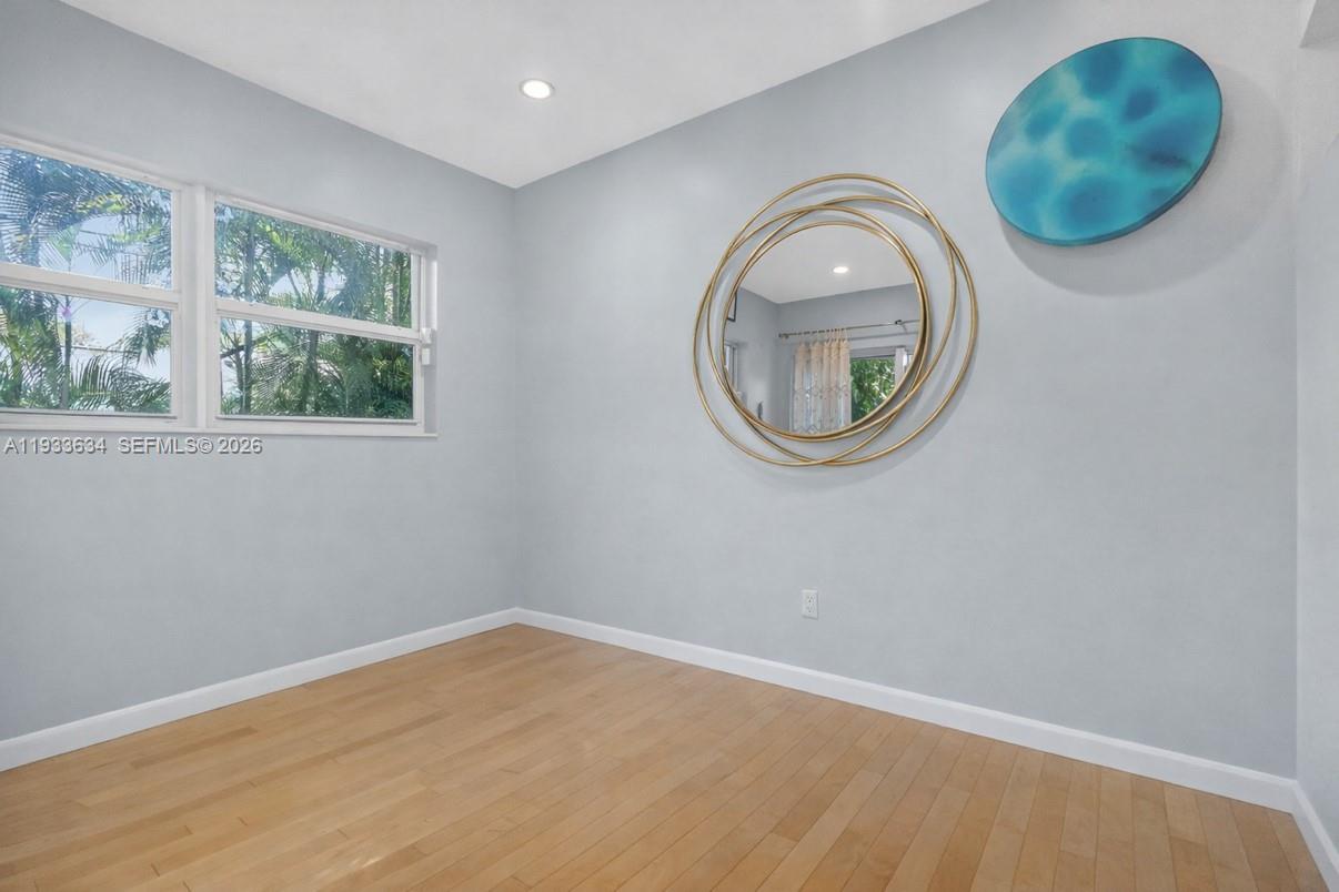 11890 Southwest 72nd Place Pinecrest, FL 33156 - Photo 23 of 39 an empty room with window