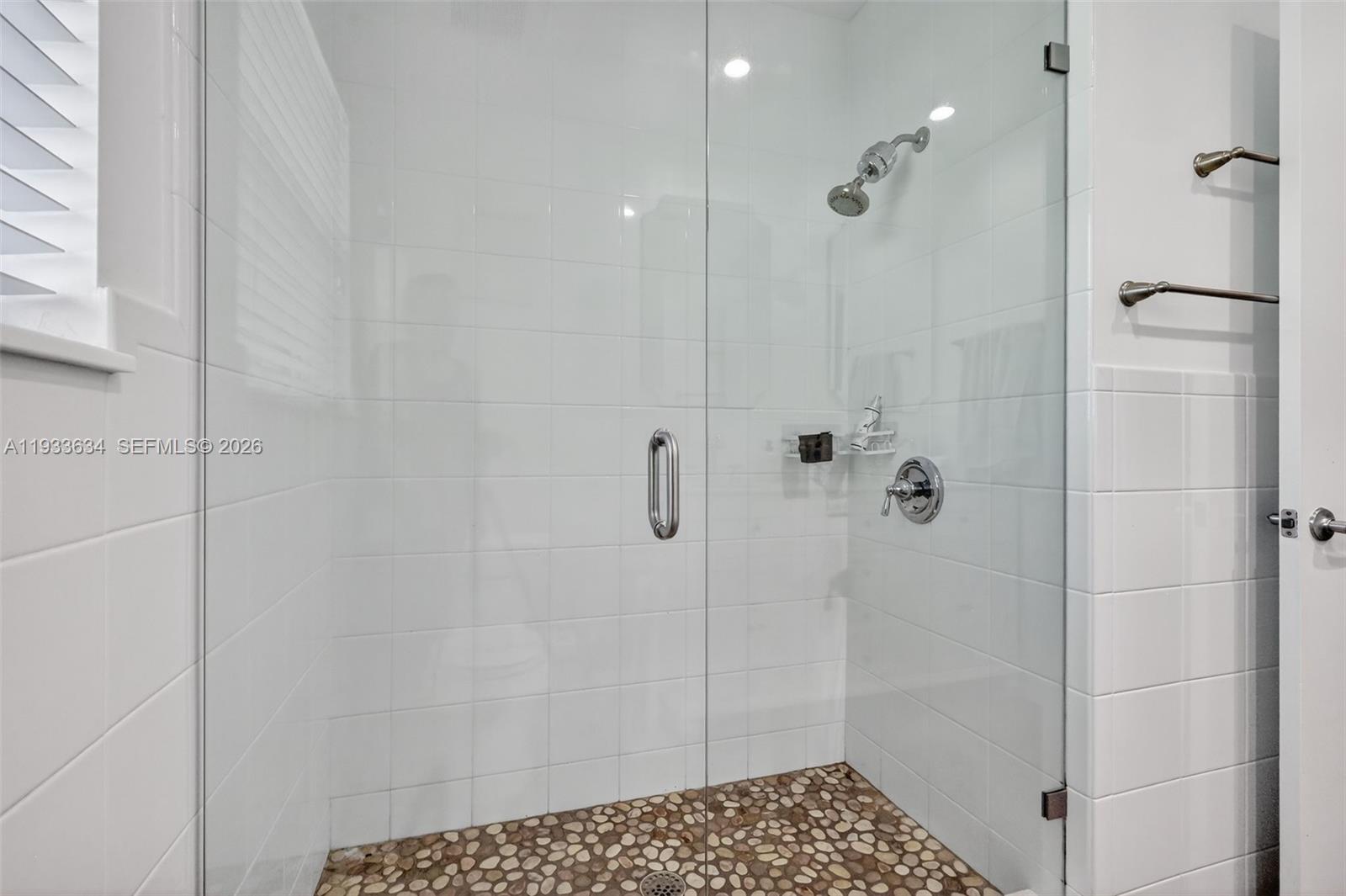 11890 Southwest 72nd Place Pinecrest, FL 33156 - Photo 29 of 39 a bathroom with a shower