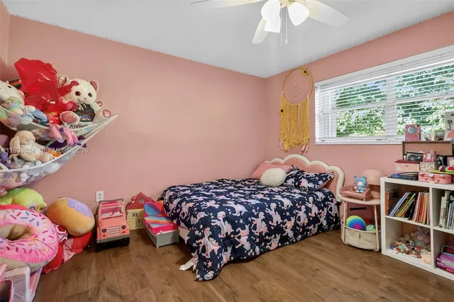 a bedroom with bed and a window