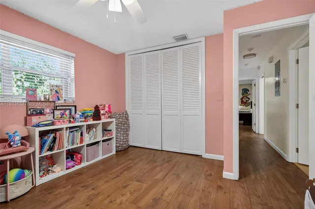 a room with furniture and a book shelf