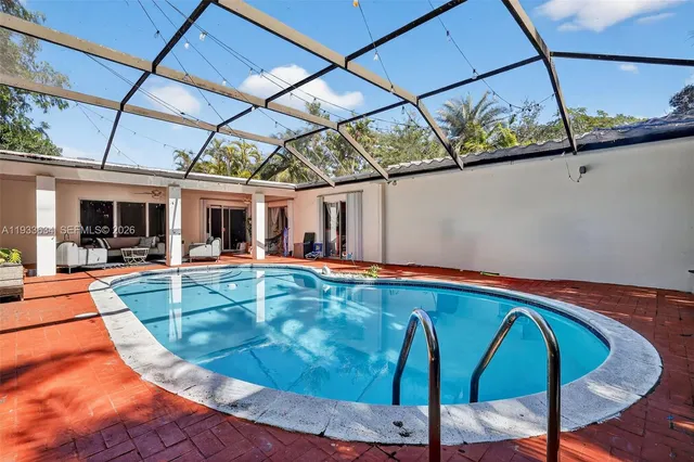 a view of a swimming pool with a patio
