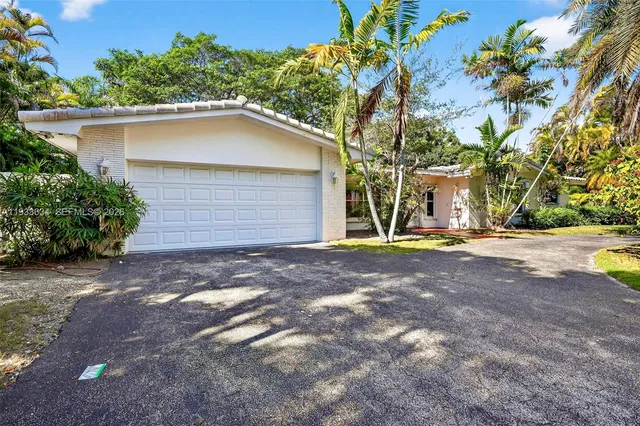 a house with trees in the background