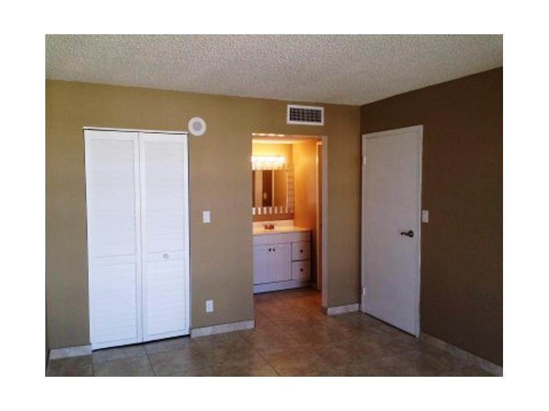 17021 North Bay Road, Unit 910 Sunny Isles Beach, FL 33160 - Photo 14 of 19 a view of an empty room with wooden floor