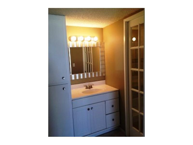 17021 North Bay Road, Unit 910 Sunny Isles Beach, FL 33160 - Photo 17 of 19 a bathroom with a sink and a mirror