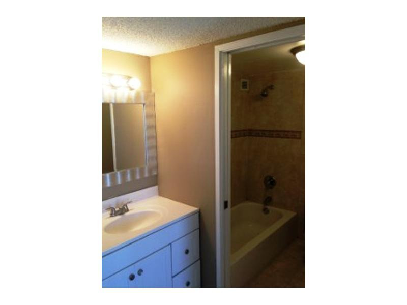 17021 North Bay Road, Unit 910 Sunny Isles Beach, FL 33160 - Photo 18 of 19 a bathroom with a sink shower and a mirror