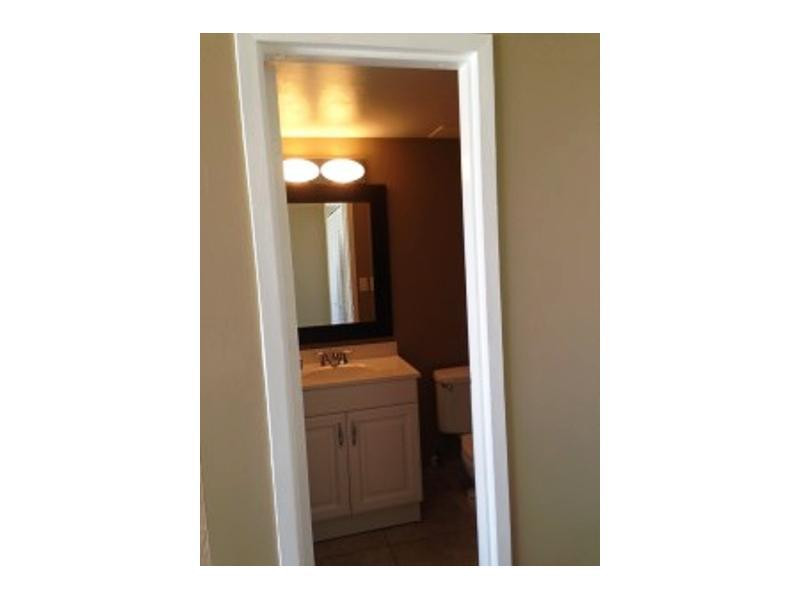 17021 North Bay Road, Unit 910 Sunny Isles Beach, FL 33160 - Photo 7 of 19 a view of a bathroom with a sink and mirror