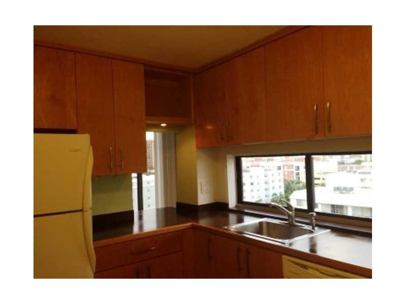 17021 North Bay Road, Unit 910 Sunny Isles Beach, FL 33160 - Photo 10 of 19 a kitchen with a sink and a large window