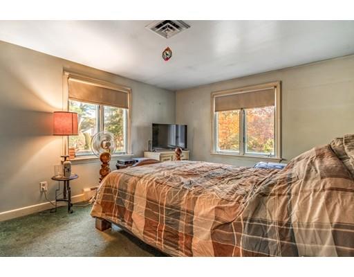 22 Bishops Lane Lynnfield, MA 01940 - Photo 14 of 31 a bedroom with a bed next to a window