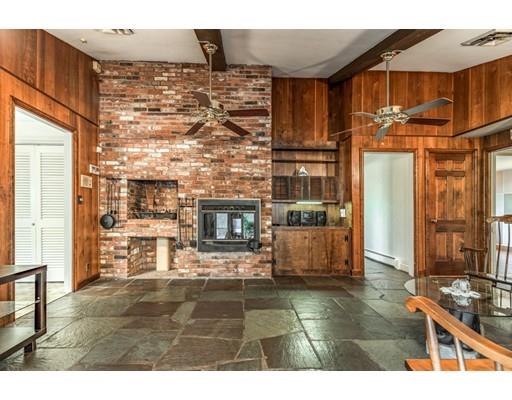 22 Bishops Lane Lynnfield, MA 01940 - Photo 22 of 31 a living room with fireplace furniture and a fireplace