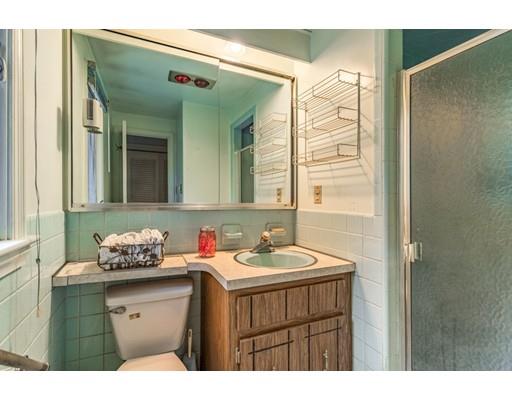 22 Bishops Lane Lynnfield, MA 01940 - Photo 23 of 31 a bathroom with a sink vanity granite and a mirror