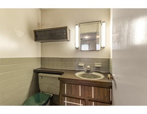 22 Bishops Lane Lynnfield, MA 01940 - Photo 25 of 31 a bathroom with a sink and a mirror