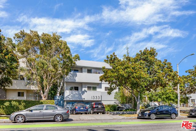 a view of a cars parked in front of a building