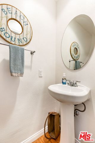 a bathroom with a sink and mirror