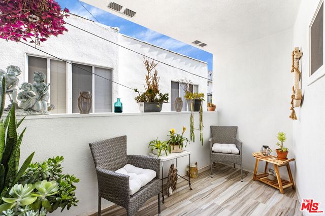a view of a chairs and table in a patio