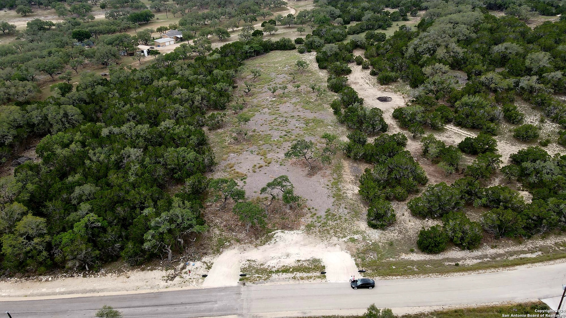 272 Restless Wind Spring Branch, TX 78070 - Photo 1 of 10 an aerial view of a house with a yard and garage