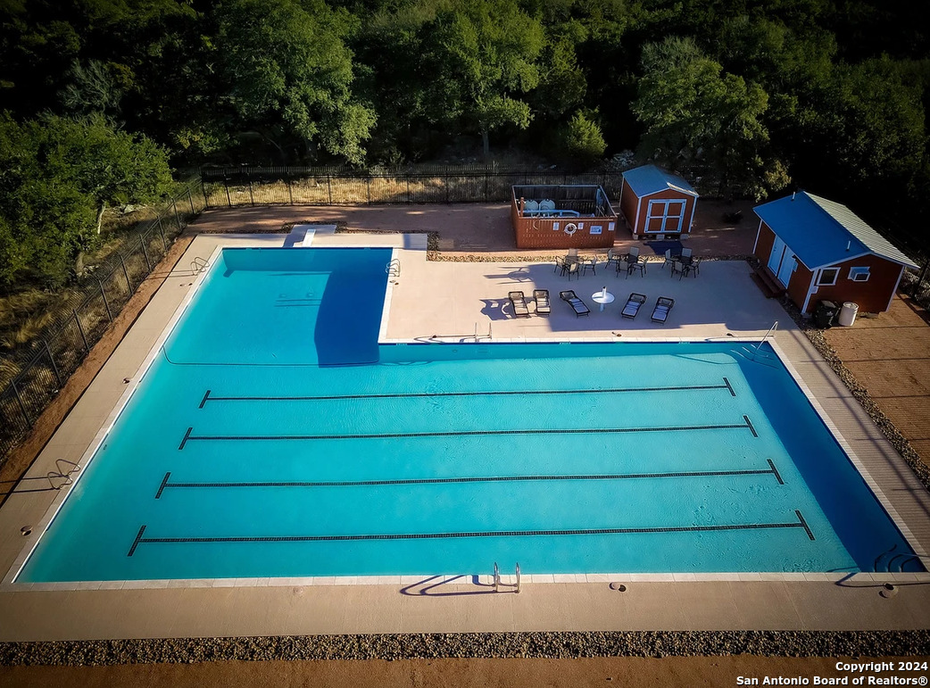 272 Restless Wind Spring Branch, TX 78070 - Photo 7 of 10 a view of swimming pool with chairs