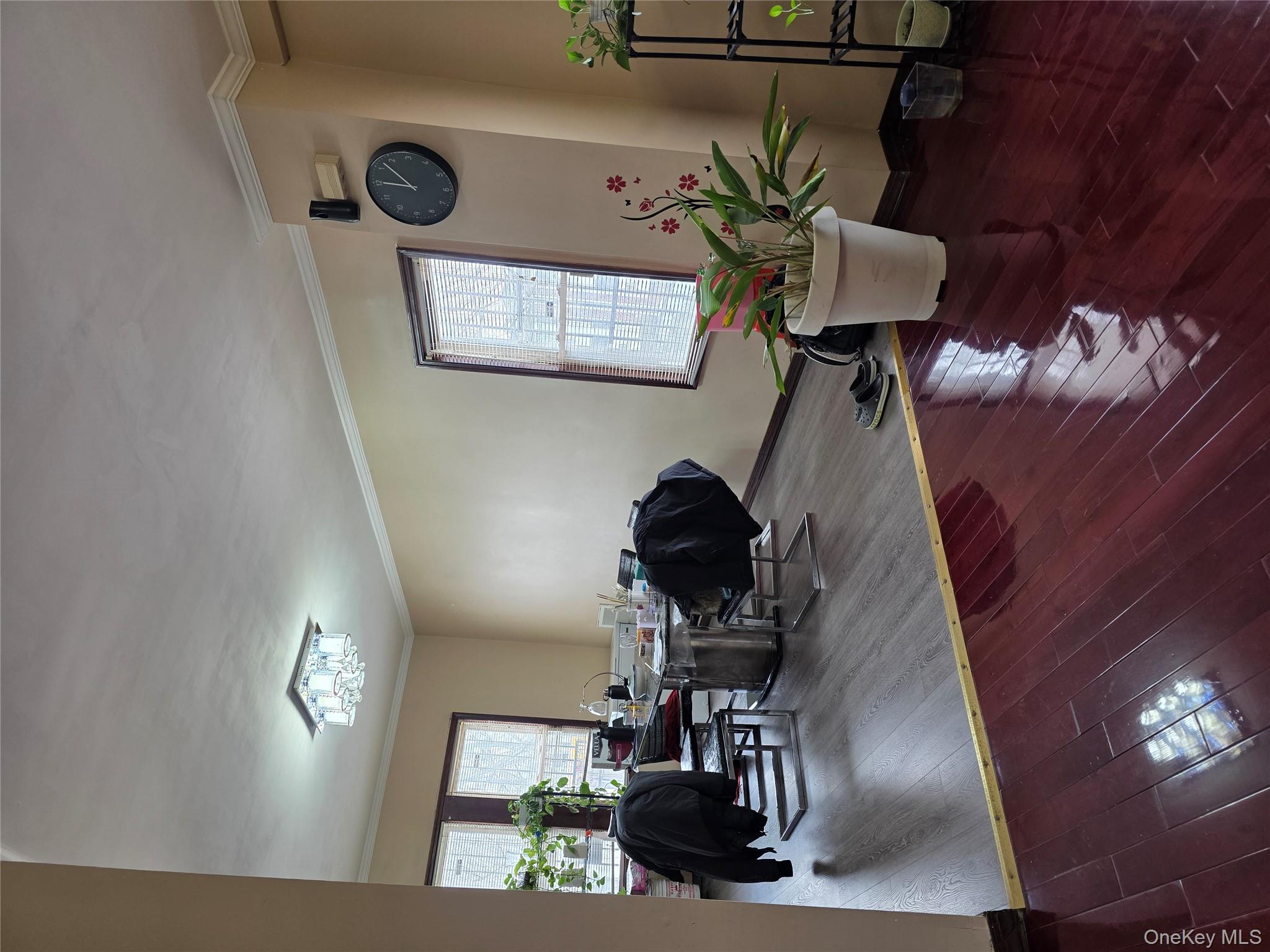 91-02 96th Street Queens, NY 11421 - Photo 3 of 12 a living room with furniture potted plant and window