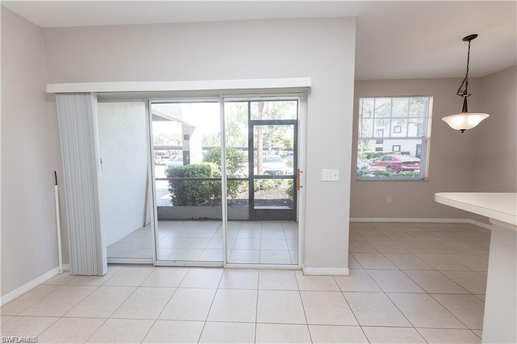 7975 Preserve Circle, Unit 1013 Naples, FL 34119 - Photo 1 of 16 a view of an empty room with a window