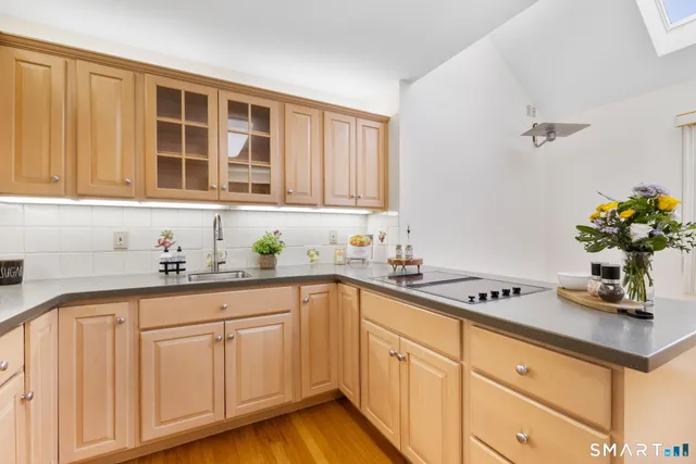a kitchen with sink cabinets and window