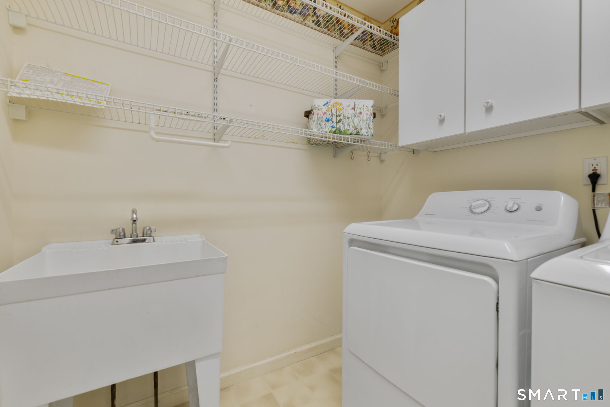 12 Elizabeth Court, Unit 12 Groton, CT 06340 - Photo 26 of 40 First floor laundry room with a work sink
