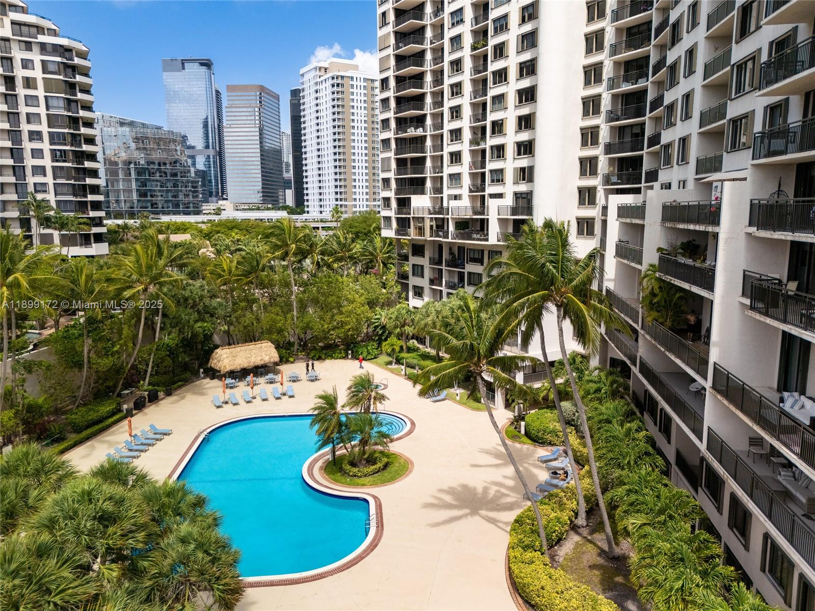 540 Brickell Key Drive, Unit 202 Miami, FL 33131 - Photo 1 of 60 a view of a swimming pool with chairs