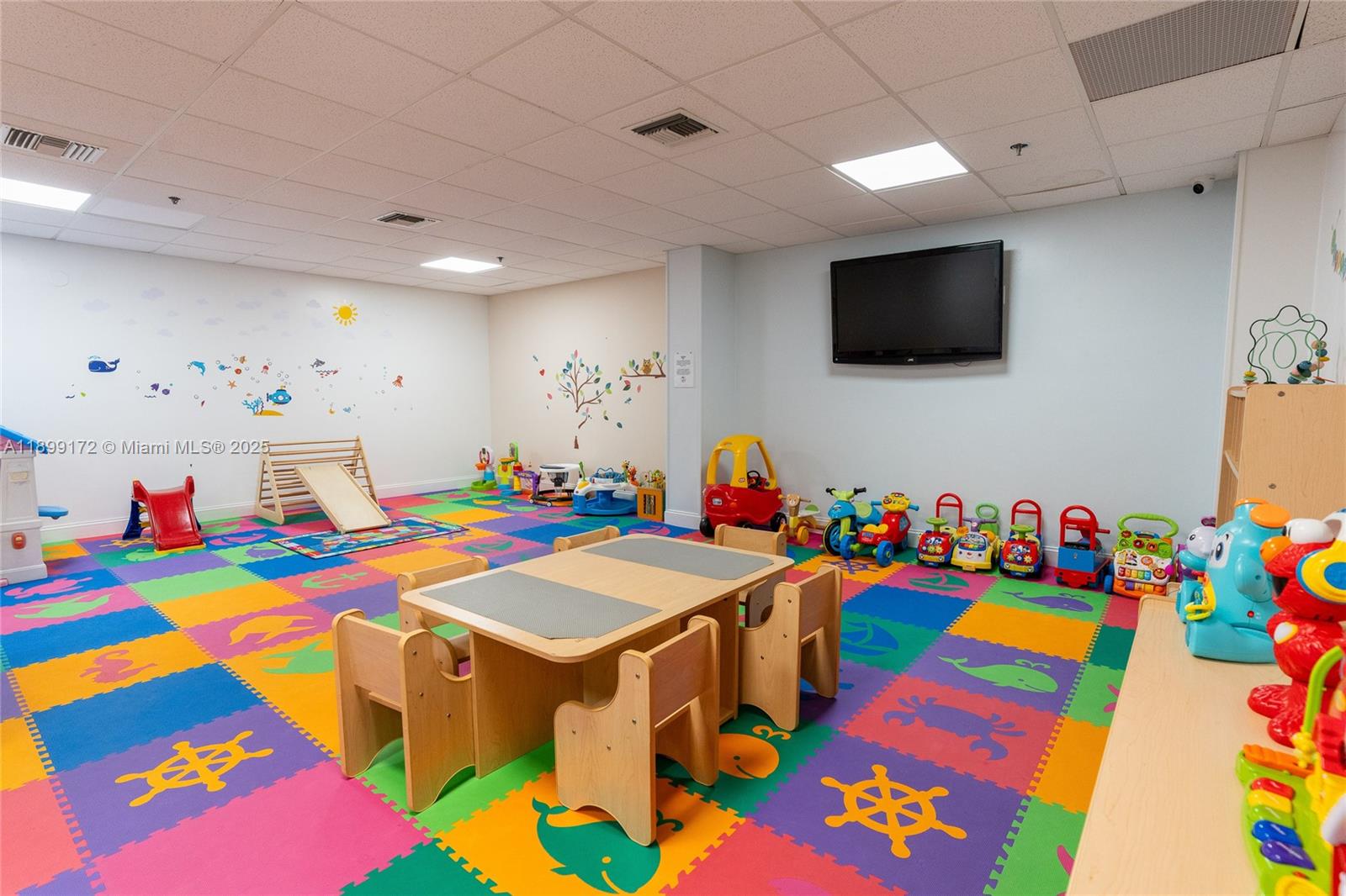 540 Brickell Key Drive, Unit 202 Miami, FL 33131 - Photo 12 of 60 a group of people sitting in a living room