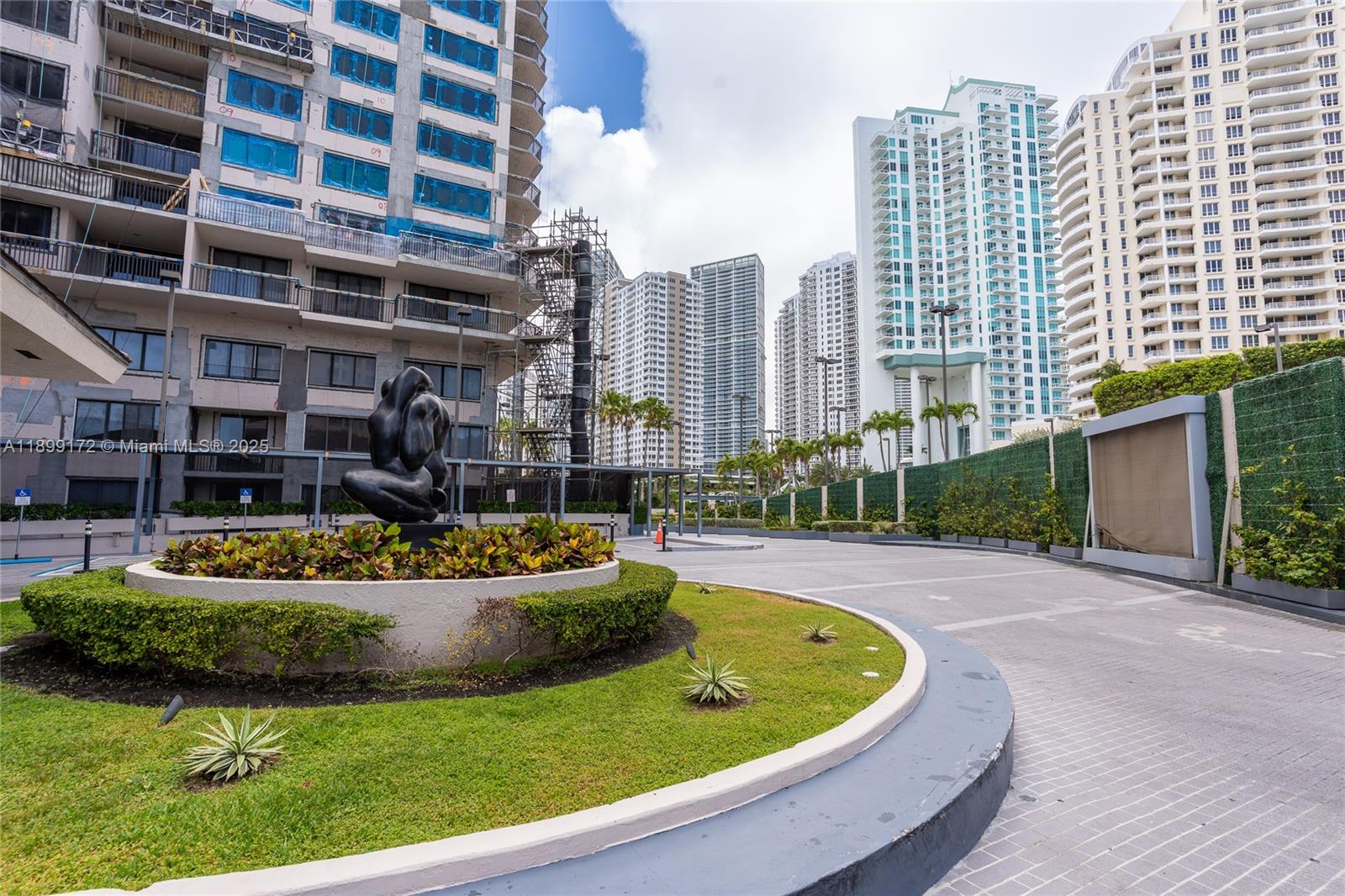 540 Brickell Key Drive, Unit 202 Miami, FL 33131 - Photo 14 of 60 a view of a swimming pool with a lounge chairs
