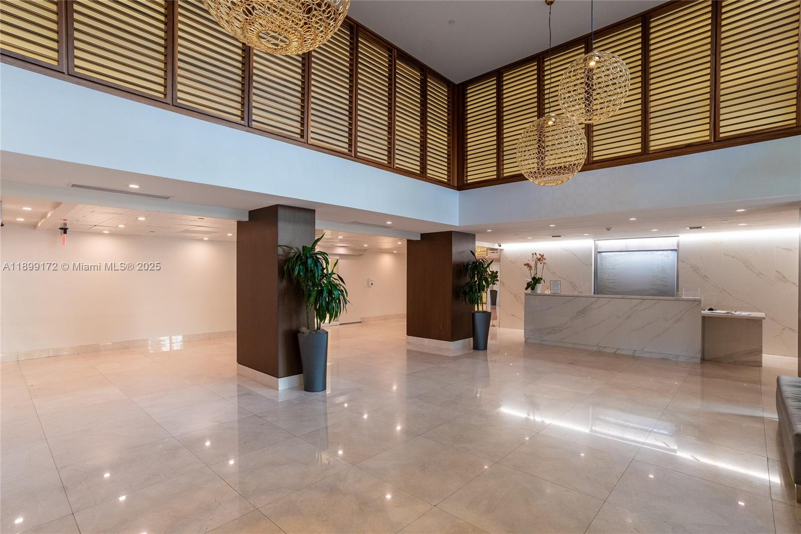 540 Brickell Key Drive, Unit 202 Miami, FL 33131 - Photo 16 of 60 a view of a hallway with seating space