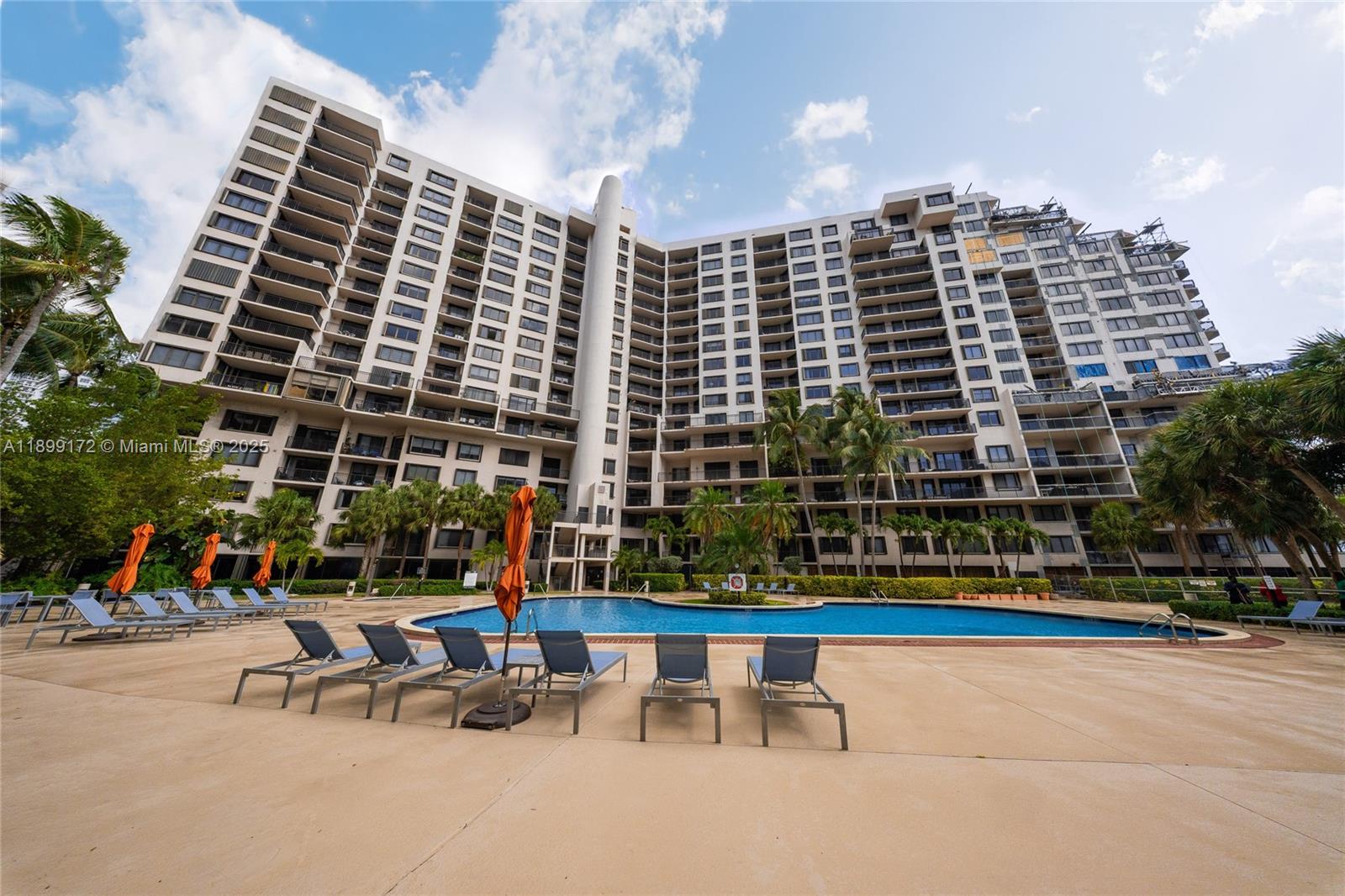 540 Brickell Key Drive, Unit 202 Miami, FL 33131 - Photo 20 of 60 a view of building with lot of windows and outdoor seating
