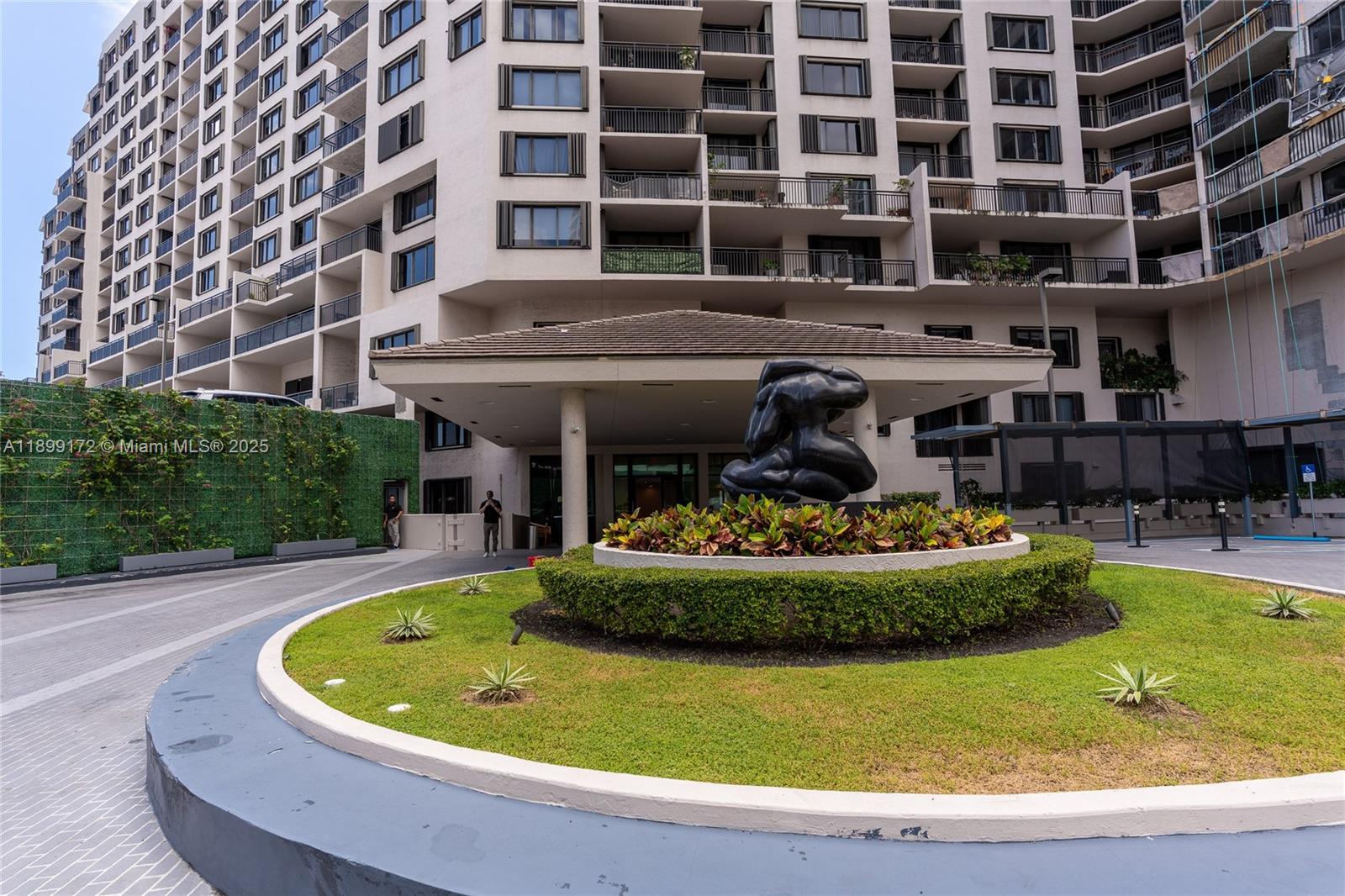 540 Brickell Key Drive, Unit 202 Miami, FL 33131 - Photo 23 of 60 a view of a swimming pool with a garden