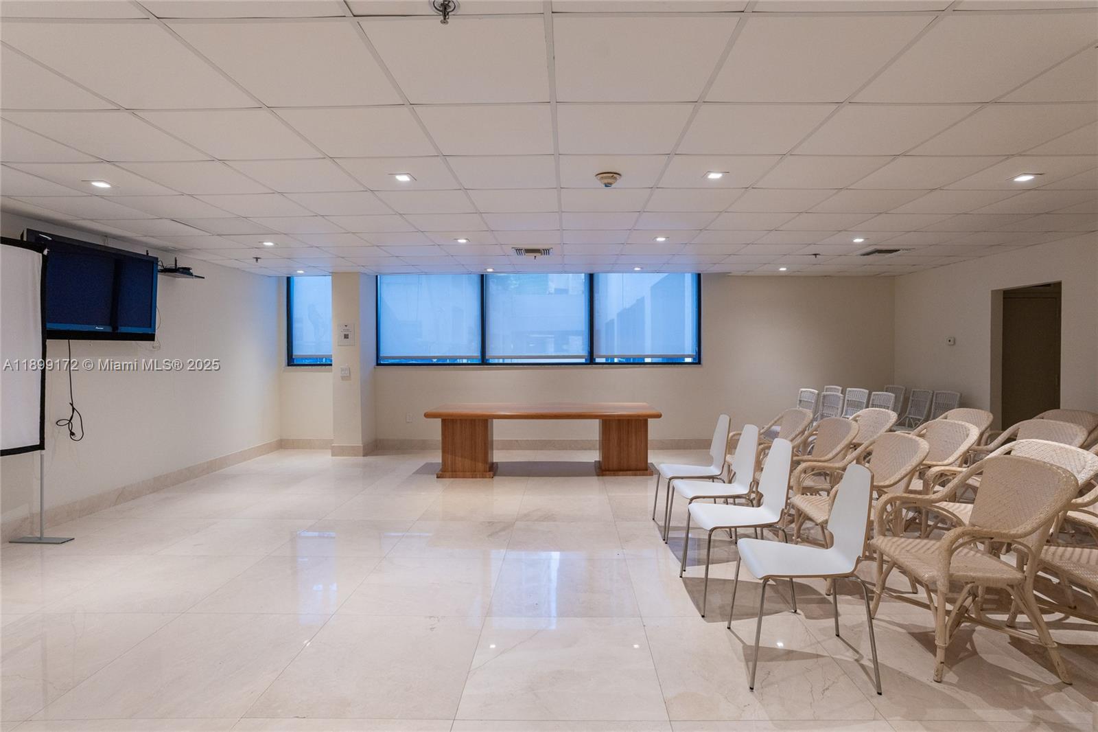 540 Brickell Key Drive, Unit 202 Miami, FL 33131 - Photo 27 of 60 a living room with stainless steel appliances kitchen island granite countertop furniture and a wooden cabinets