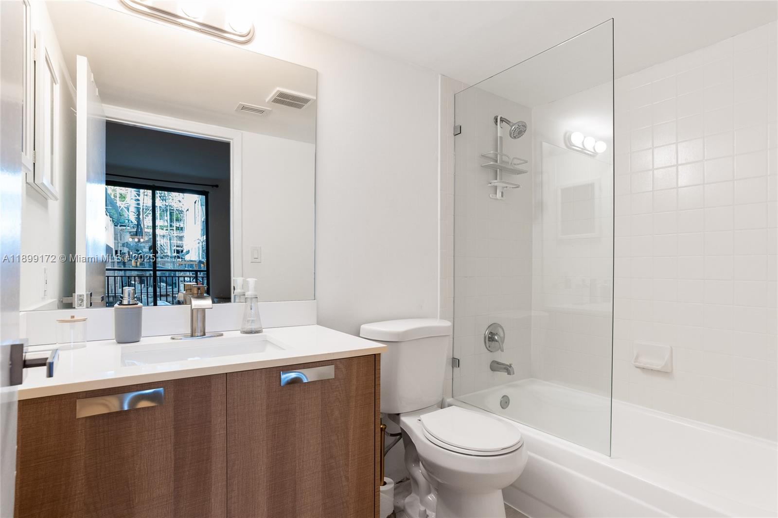 540 Brickell Key Drive, Unit 202 Miami, FL 33131 - Photo 42 of 60 a bathroom with a sink toilet and shower