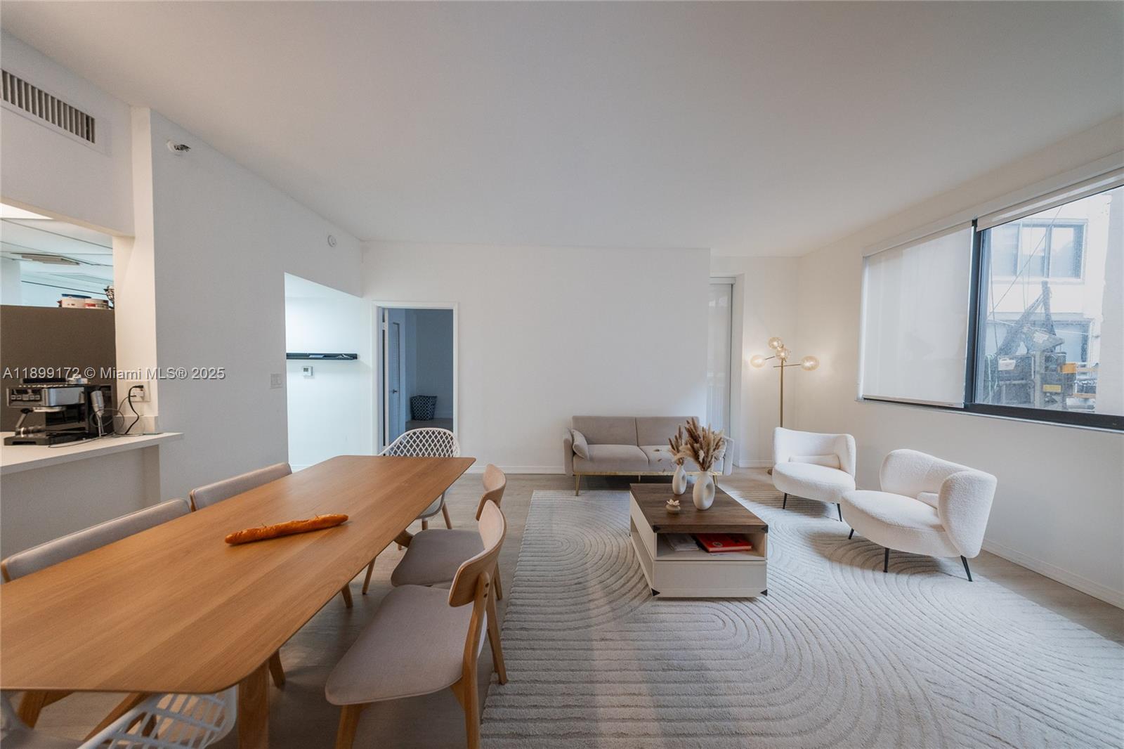 540 Brickell Key Drive, Unit 202 Miami, FL 33131 - Photo 53 of 60 a living room with furniture and a table